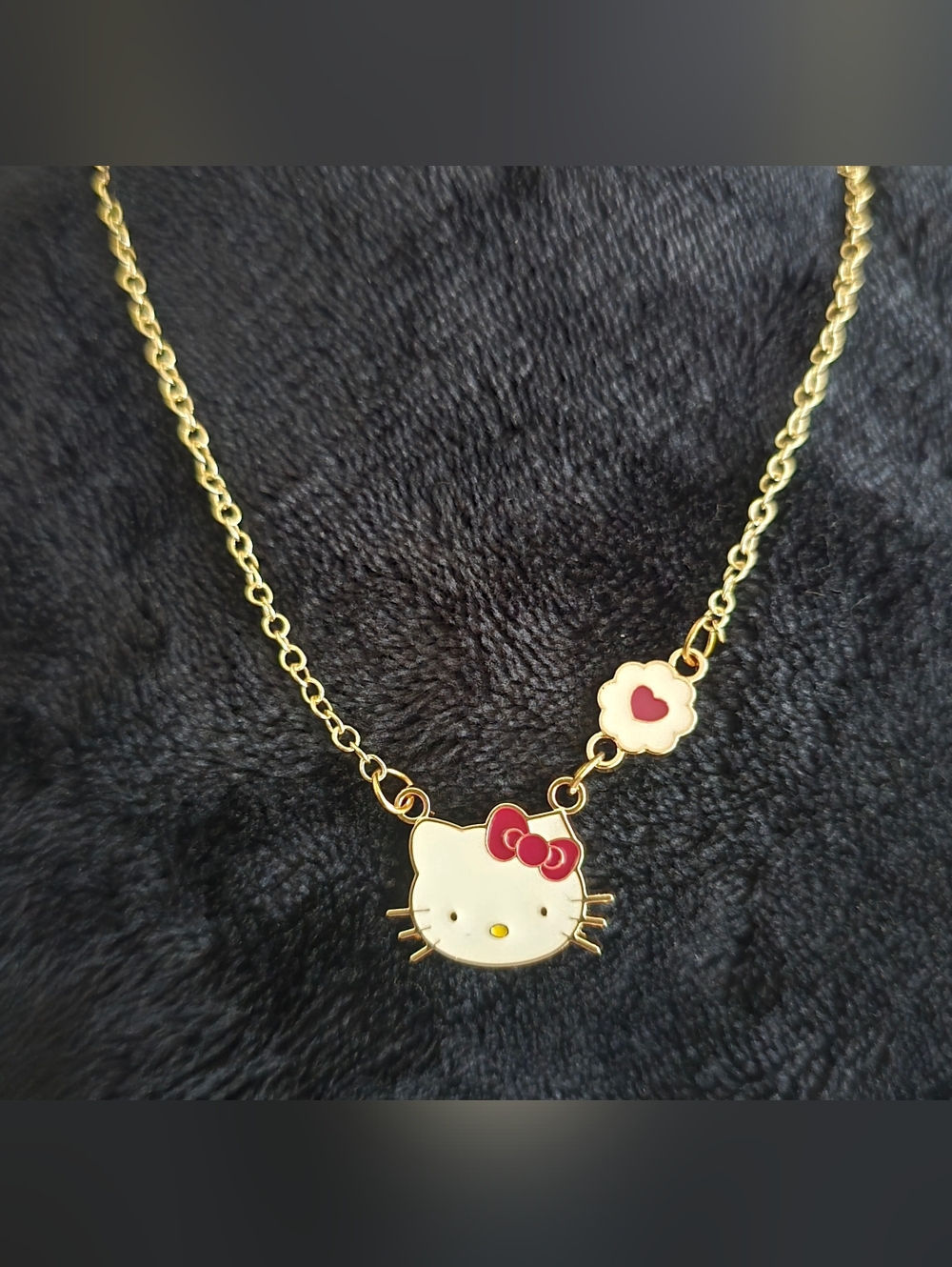 Sanrio Gold-Tone Hello Kitty Pendant Necklace with White Enamel & Red Bow